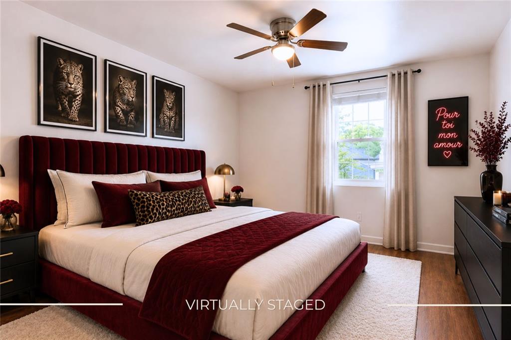 3203 East Point Street, Unit 4 Atlanta, GA 30344 - Photo 13 of 18 a bedroom with a large bed and a window