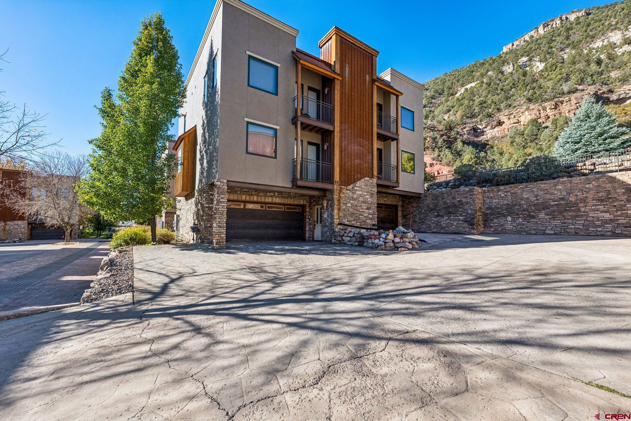 1422 Animas View Drive, Unit 55 Durango, CO 81301 - Photo 3 of 44 a building with trees in front of it
