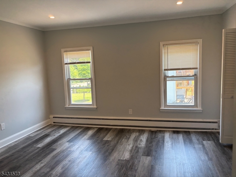 358 Woodland Road, Unit 2 Madison, NJ 07940 - Photo 24 of 50 wooden floor in an empty room with a window