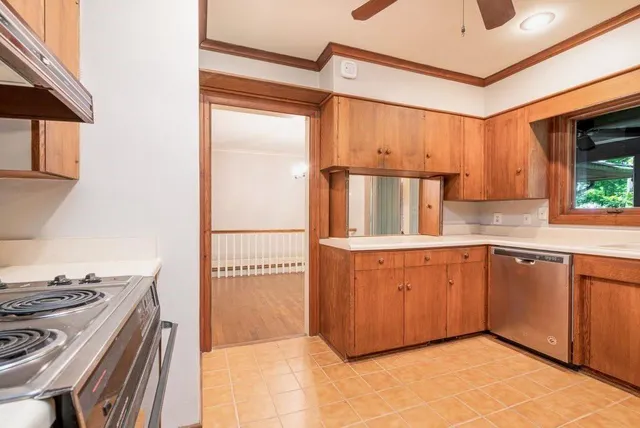 a kitchen with granite countertop a sink and a stove top oven