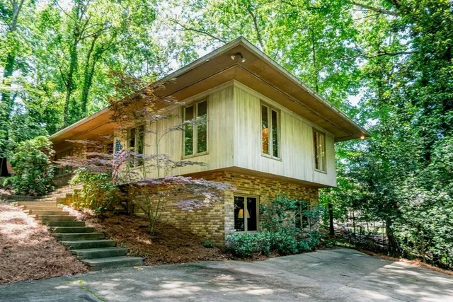 a front view of a house with garden