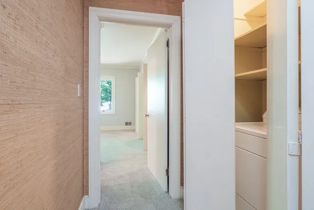 a view of a bathroom from a hallway