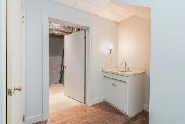 a bathroom with a sink a mirror and a toilet