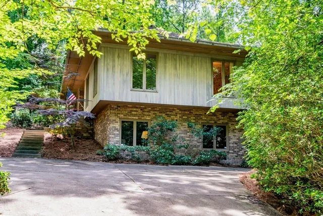a front view of a house with garden