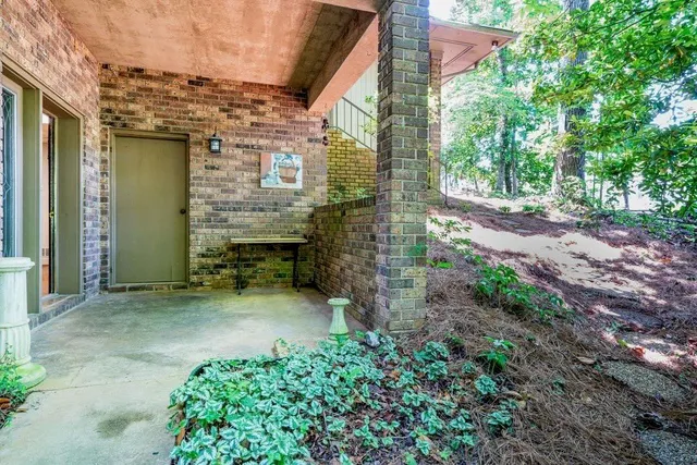a view of a pathway both side of house