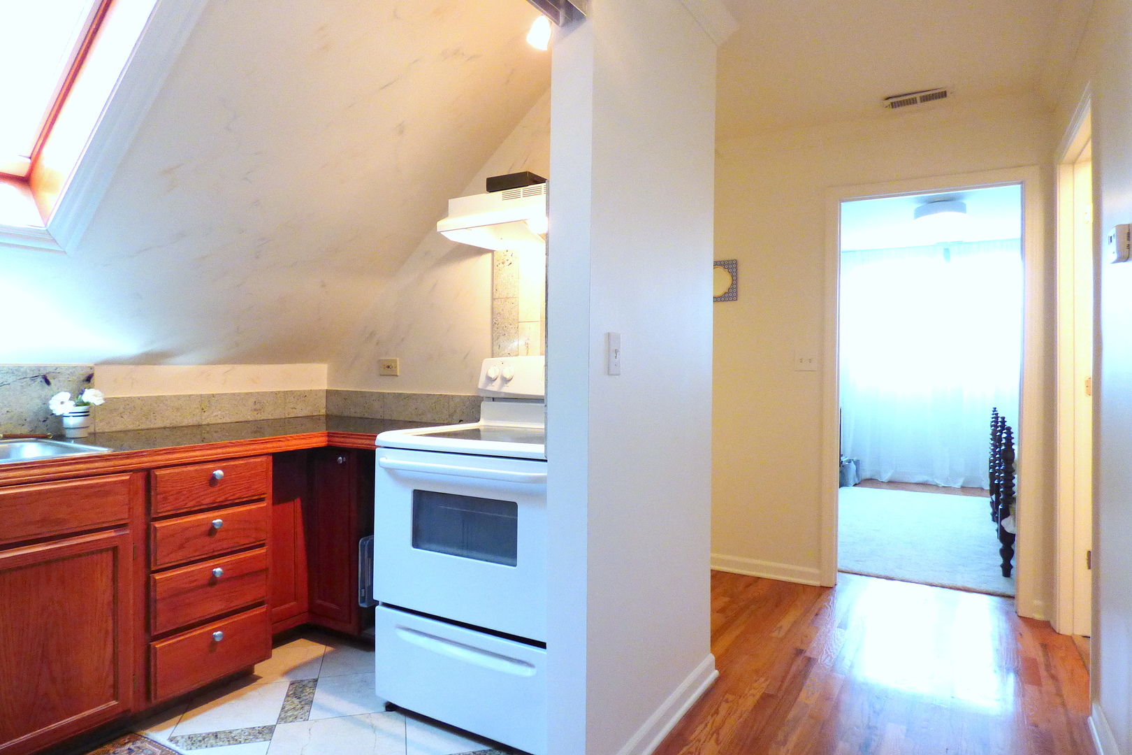 3313 North Rutherford Avenue Chicago, IL 60634 - Photo 18 of 38 a view of cabinets and wooden floor