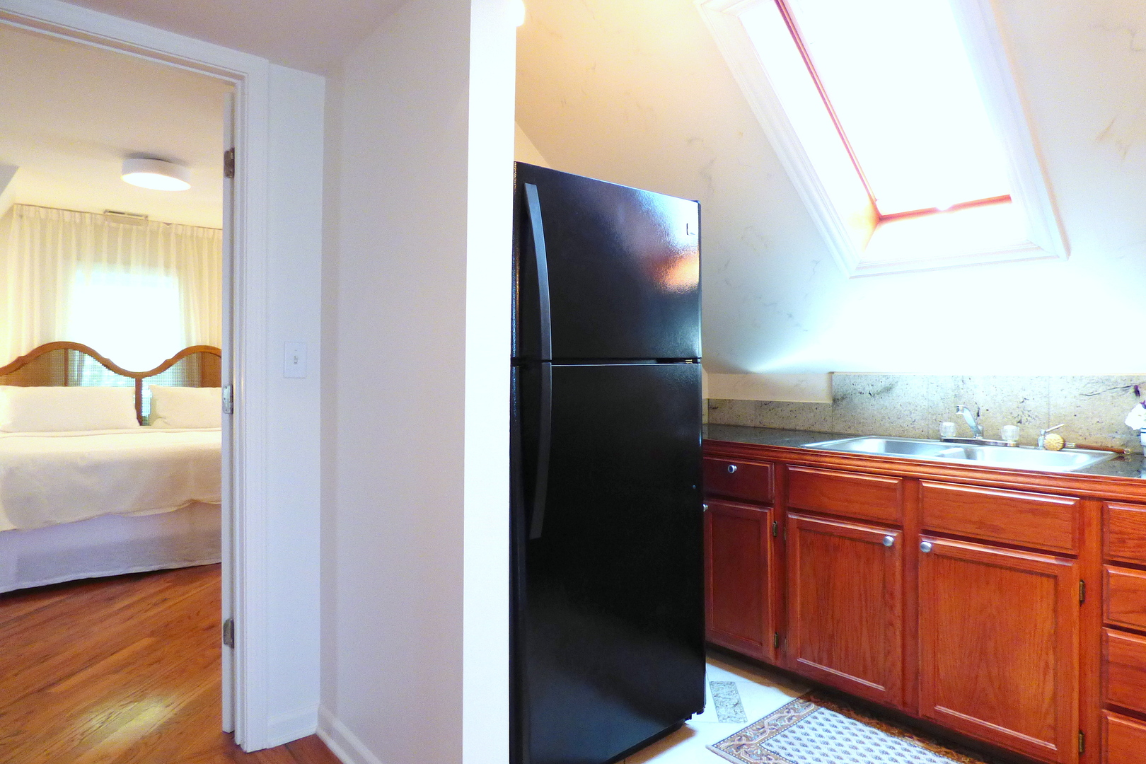 3313 North Rutherford Avenue Chicago, IL 60634 - Photo 19 of 38 a kitchen with a refrigerator and a sink