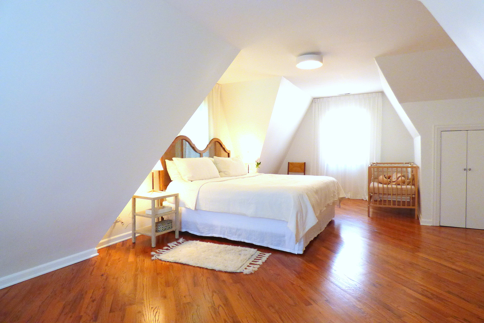 3313 North Rutherford Avenue Chicago, IL 60634 - Photo 21 of 38 a bedroom with a bed and wooden floor