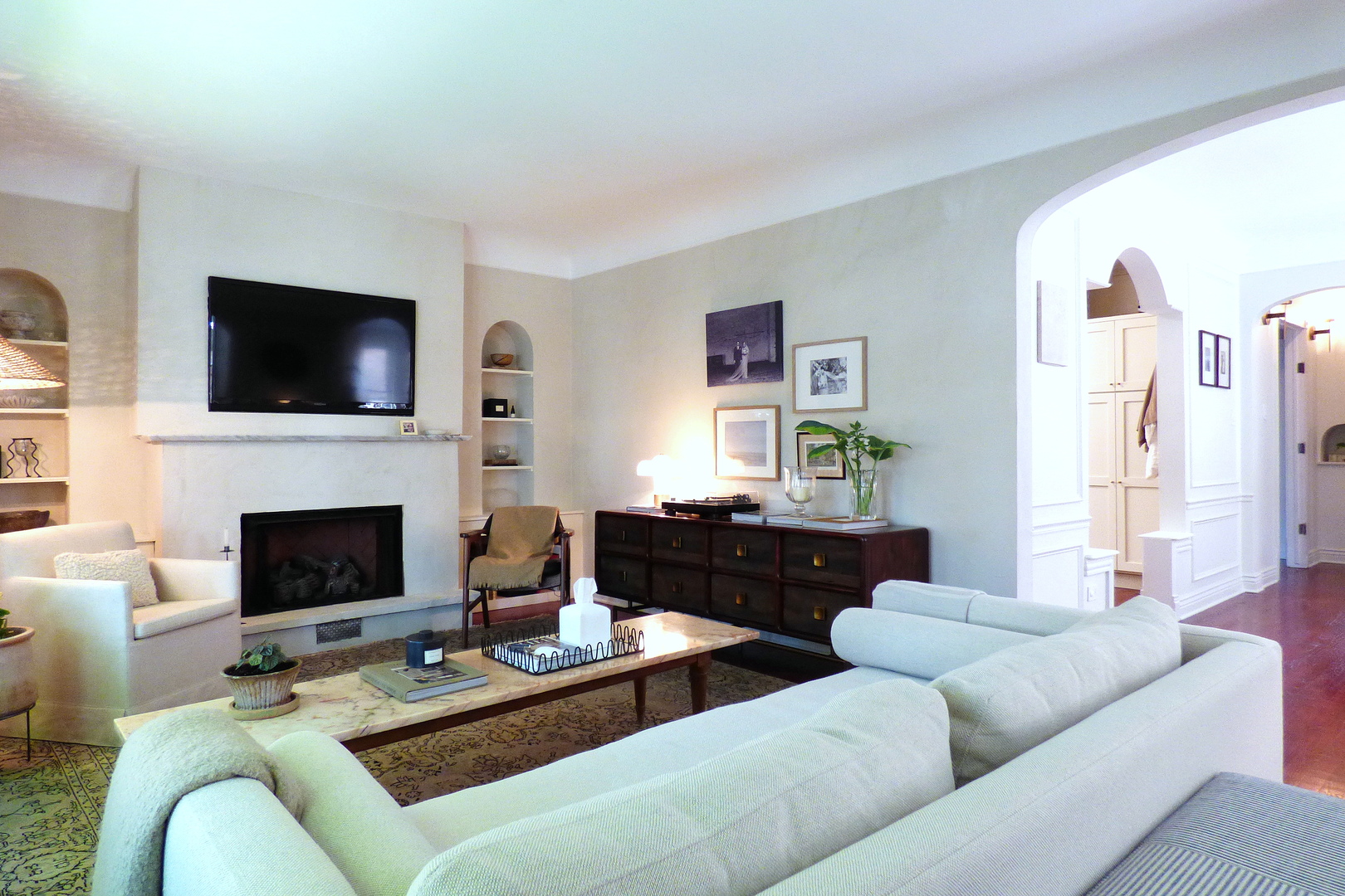 3313 North Rutherford Avenue Chicago, IL 60634 - Photo 3 of 38 a living room with furniture a fireplace and a flat screen tv
