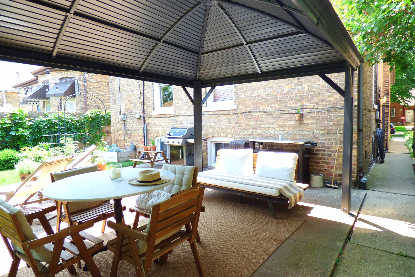 3313 North Rutherford Avenue Chicago, IL 60634 - Photo 34 of 38 a patio with water table and chairs under an umbrella