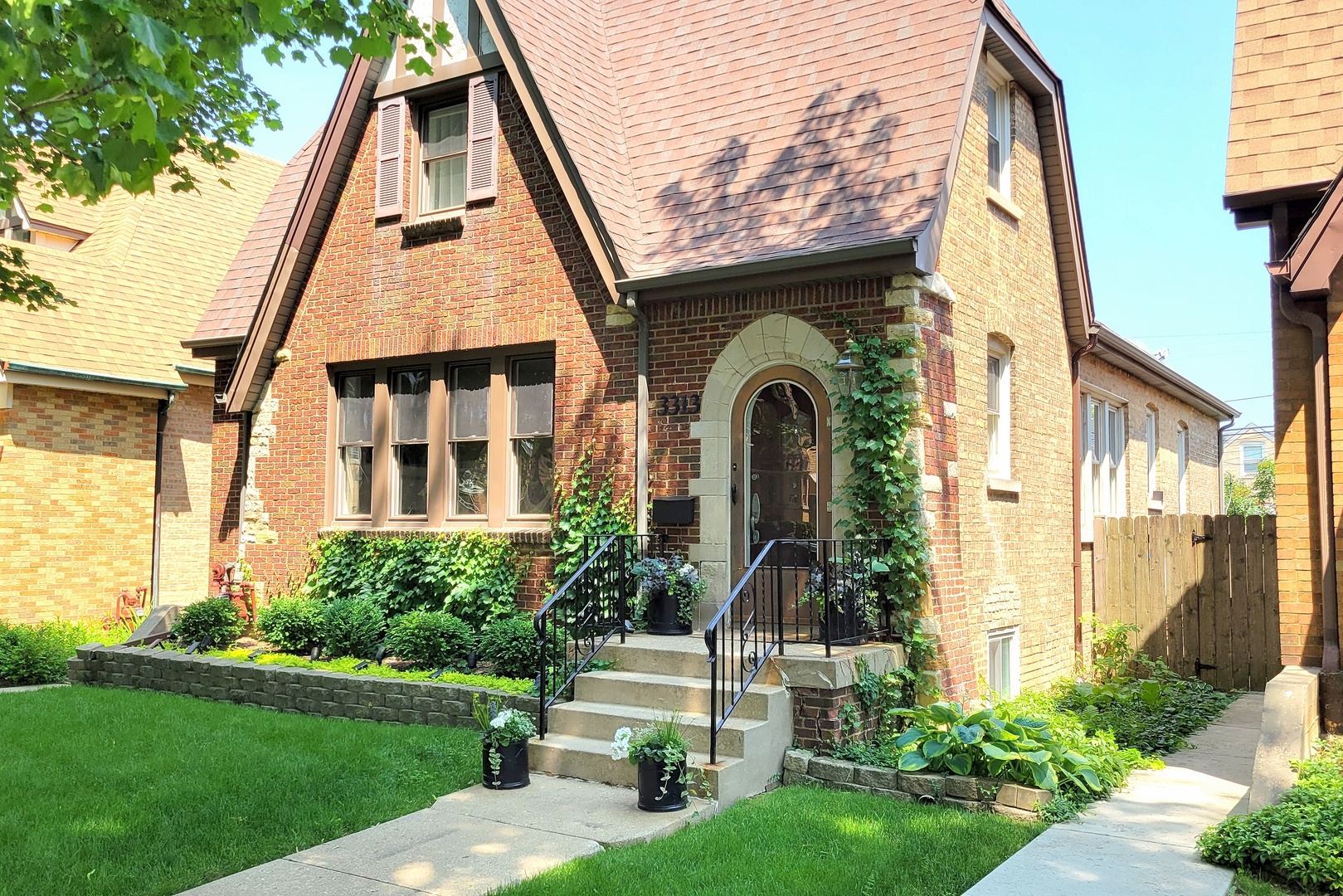 3313 North Rutherford Avenue Chicago, IL 60634 - Photo 37 of 38 a front view of a house with a yard