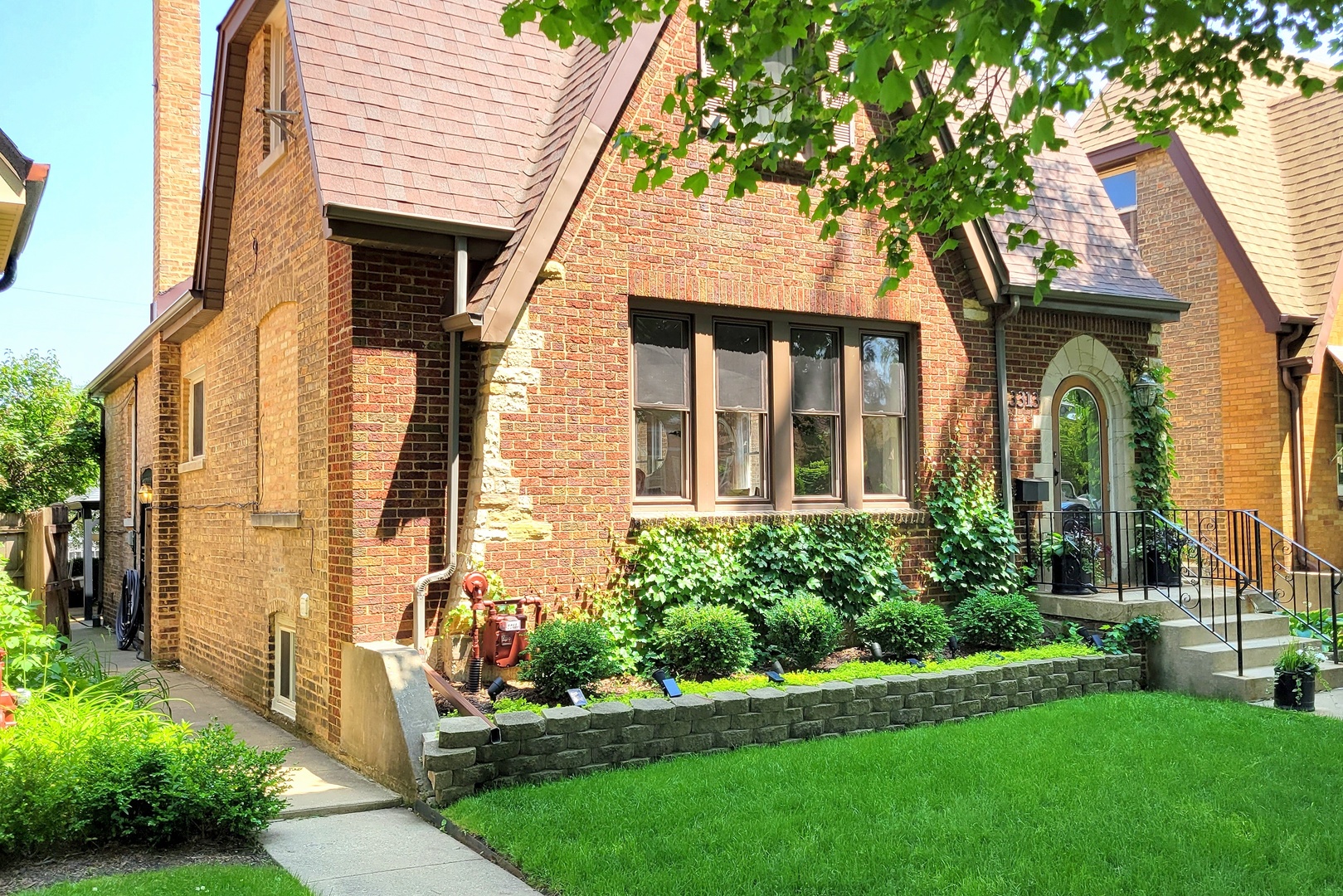 3313 North Rutherford Avenue Chicago, IL 60634 - Photo 38 of 38 a front view of a house with a garden and plants