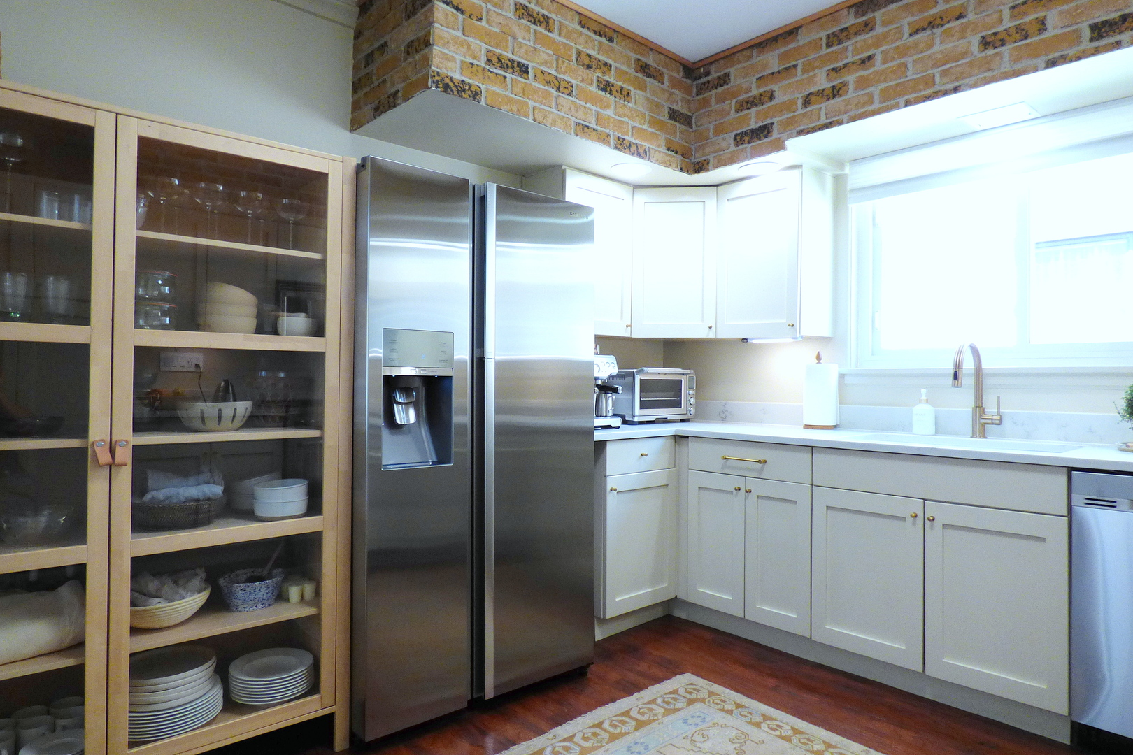 3313 North Rutherford Avenue Chicago, IL 60634 - Photo 7 of 38 a kitchen with stainless steel appliances a sink cabinets and a window
