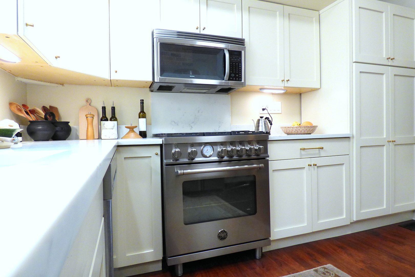 3313 North Rutherford Avenue Chicago, IL 60634 - Photo 8 of 38 a kitchen with stainless steel appliances granite countertop a stove a microwave and cabinets