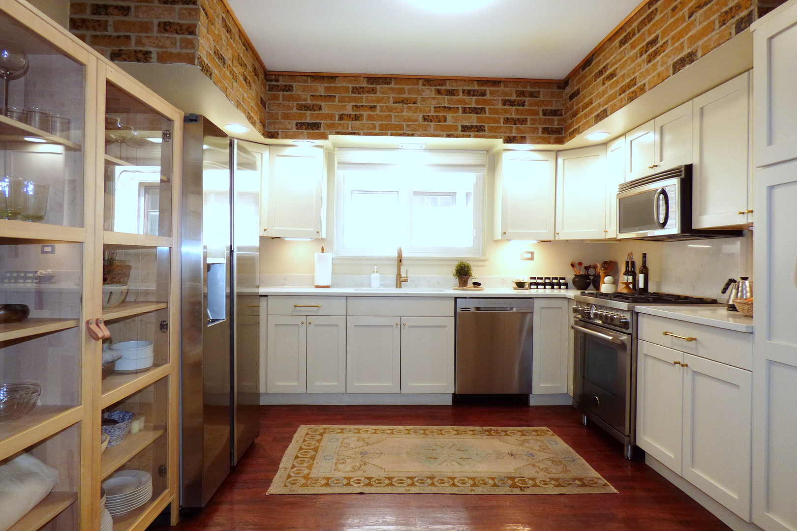 3313 North Rutherford Avenue Chicago, IL 60634 - Photo 9 of 38 a kitchen with a sink cabinets and stainless steel appliances