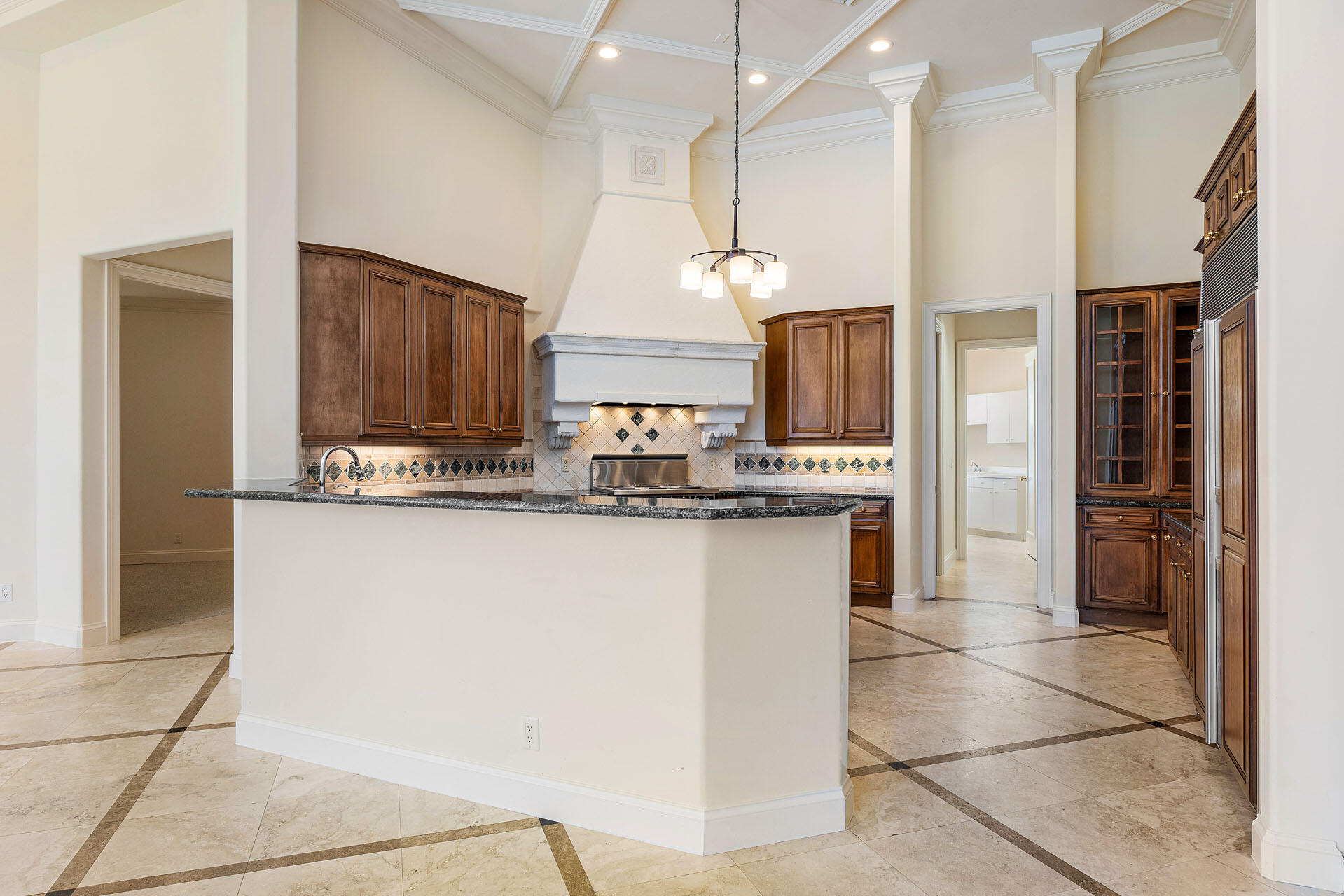 159 Coconut Palm Road Boca Raton, FL 33432 - Photo 17 of 60 a kitchen with stainless steel appliances kitchen island granite countertop a refrigerator a oven and a sink