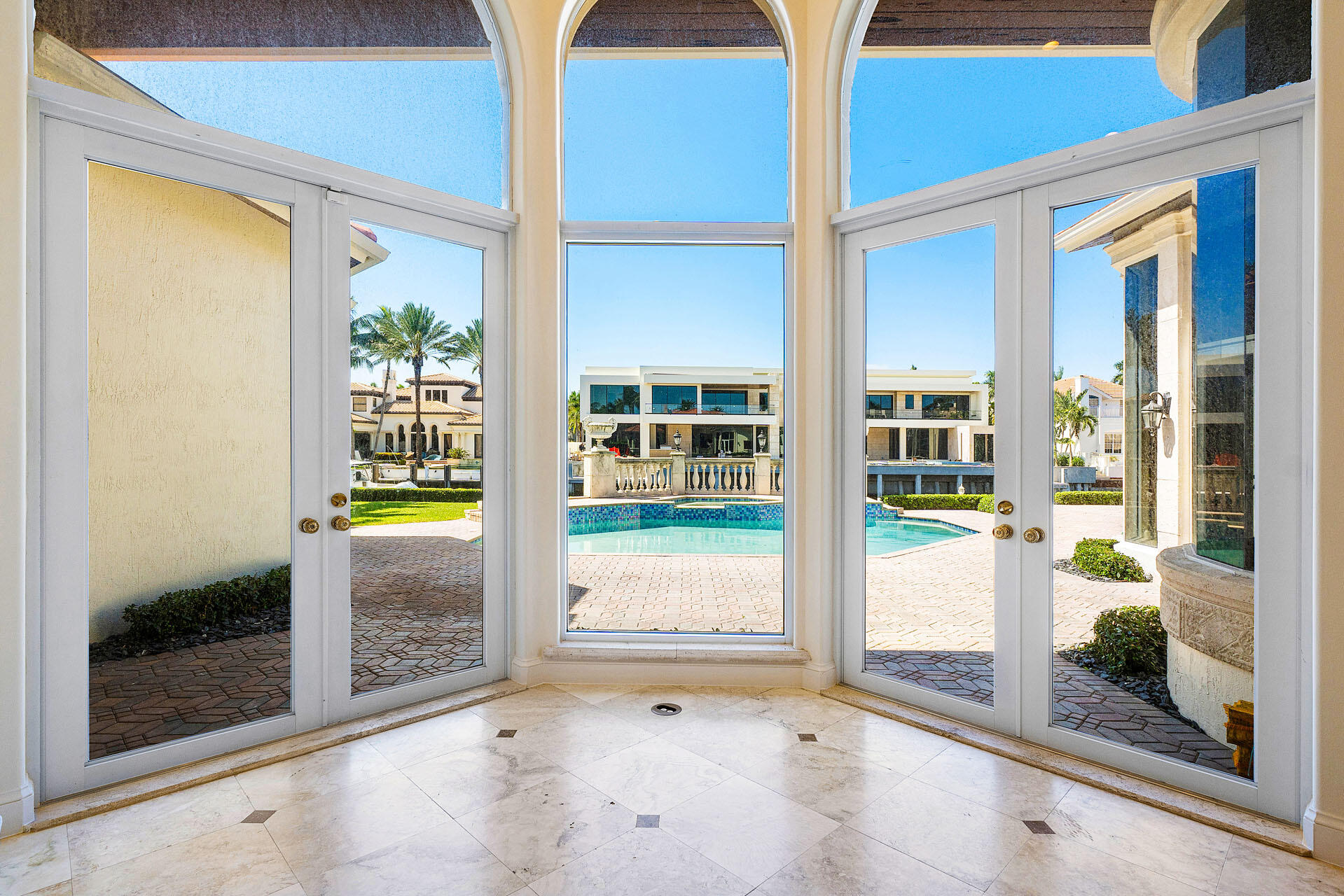 159 Coconut Palm Road Boca Raton, FL 33432 - Photo 26 of 60 a view of a bathroom with a glass door