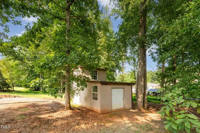 a view of a house with a tree