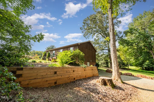 a view of a yard with a tree