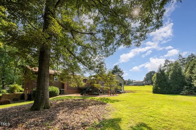 a swimming pool with trees in front of it