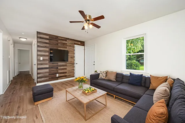 a living room with furniture and a window