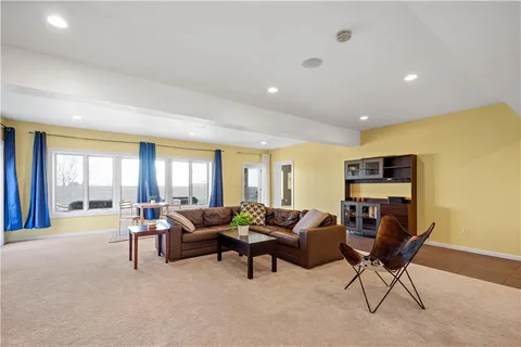a bedroom with a bed and a night stand