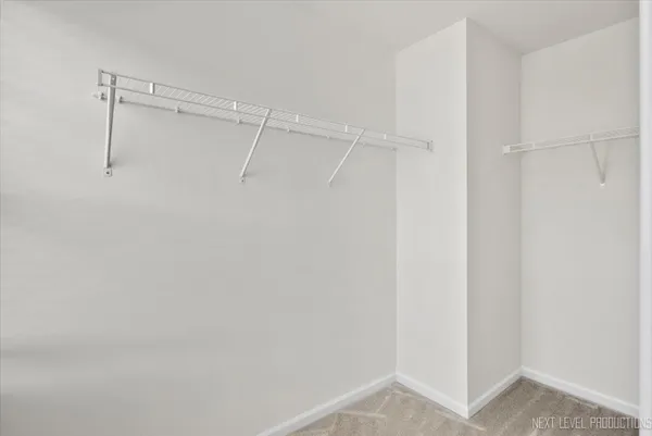 a view of an empty walk in closet