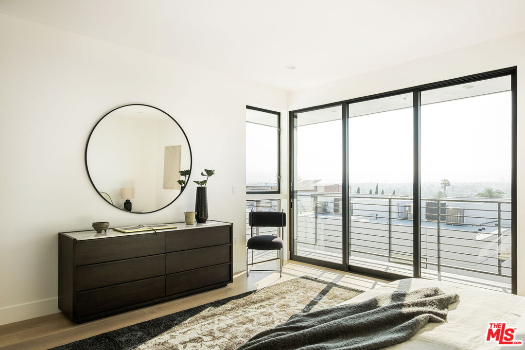 762 North Arthur Road Los Angeles, CA 90029 - Photo 17 of 30 a view of a bedroom with a bed and glass door