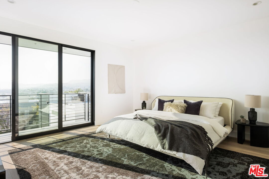 762 North Arthur Road Los Angeles, CA 90029 - Photo 18 of 30 a bedroom with a large bed and a large window