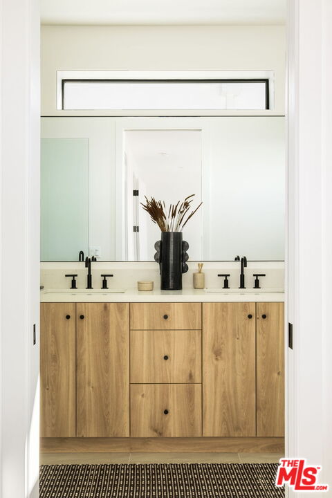 762 North Arthur Road Los Angeles, CA 90029 - Photo 22 of 30 a bathroom with a sink vanity and mirror