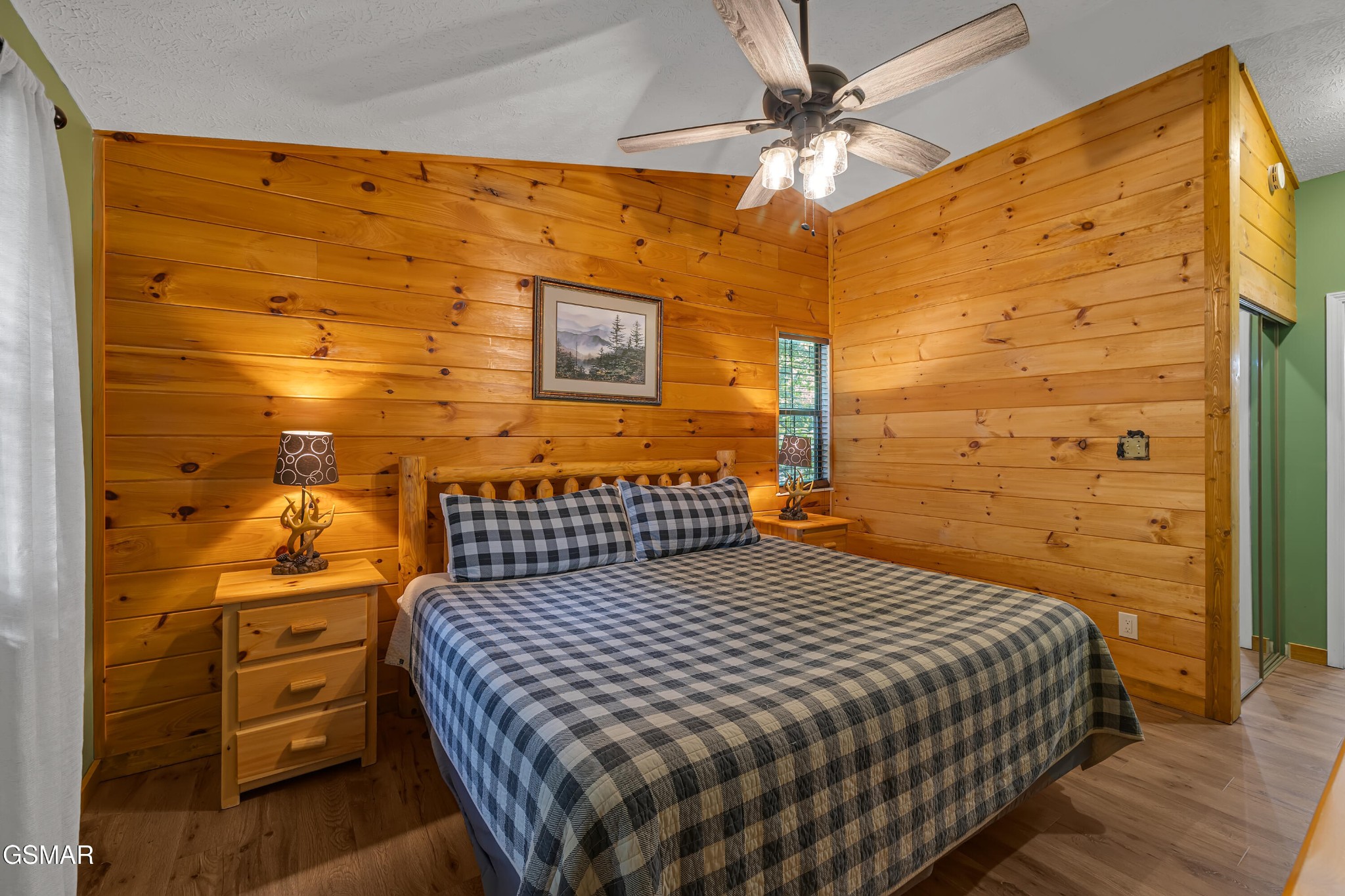 2829 Ridgeway Trail Sevierville, TN 37863 - Photo 15 of 25 a bedroom with a bed and a wall painting