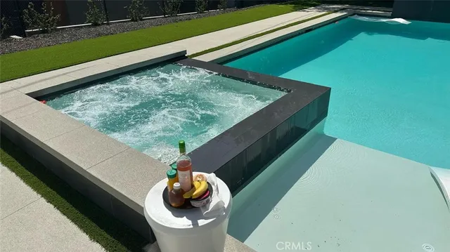 a view of a garden with a building in the background