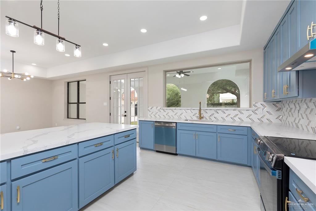 2216 South 45th Street McAllen, TX 78503 - Photo 13 of 40 a spacious bathroom with a granite countertop sink a mirror and a
