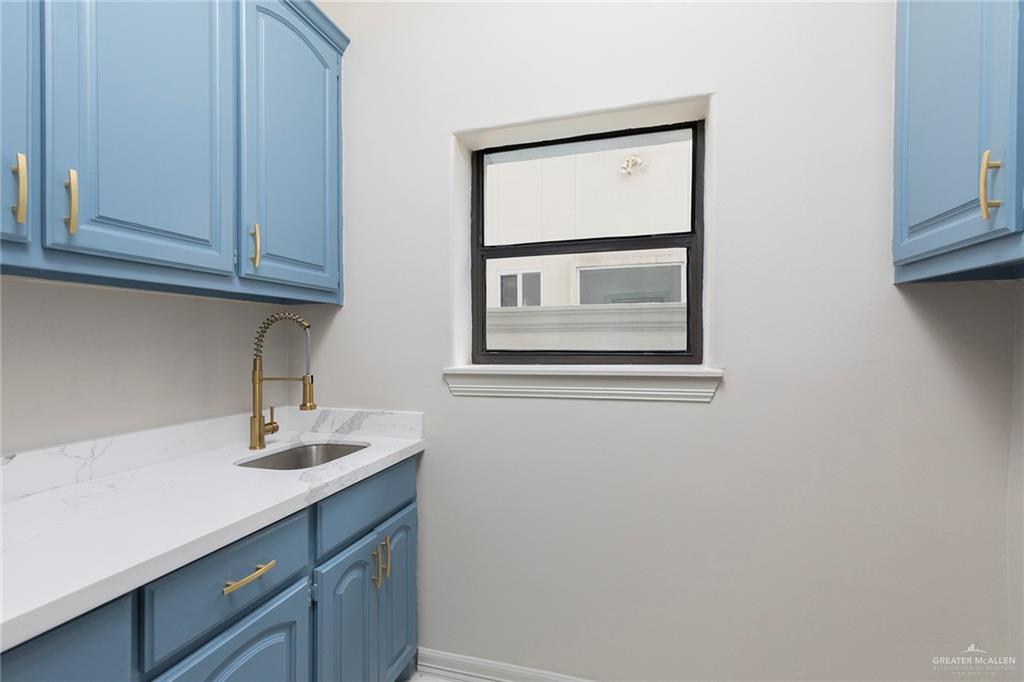 2216 South 45th Street McAllen, TX 78503 - Photo 16 of 40 a bathroom with a sink and a mirror