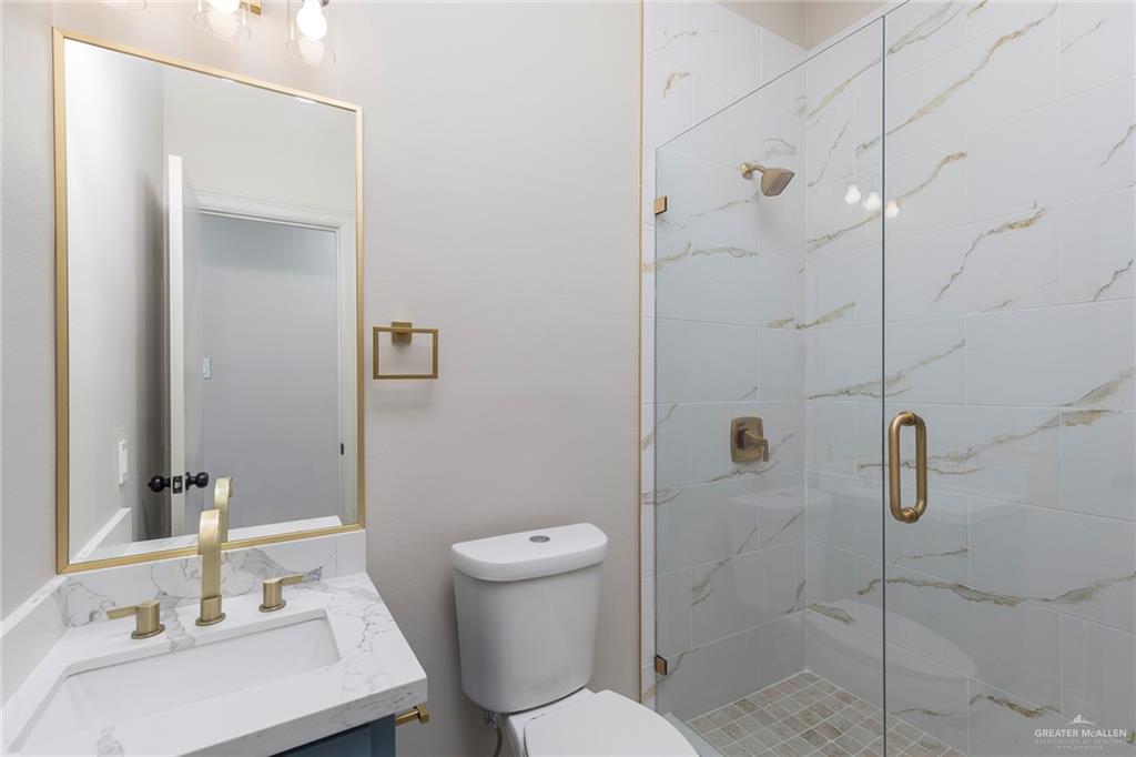 2216 South 45th Street McAllen, TX 78503 - Photo 17 of 40 a bathroom with a sink toilet and shower