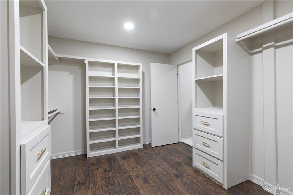 2216 South 45th Street McAllen, TX 78503 - Photo 24 of 40 a view of walk in closet with empty racks