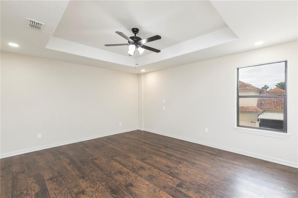 2216 South 45th Street McAllen, TX 78503 - Photo 25 of 40 wooden floor in an empty room with a window