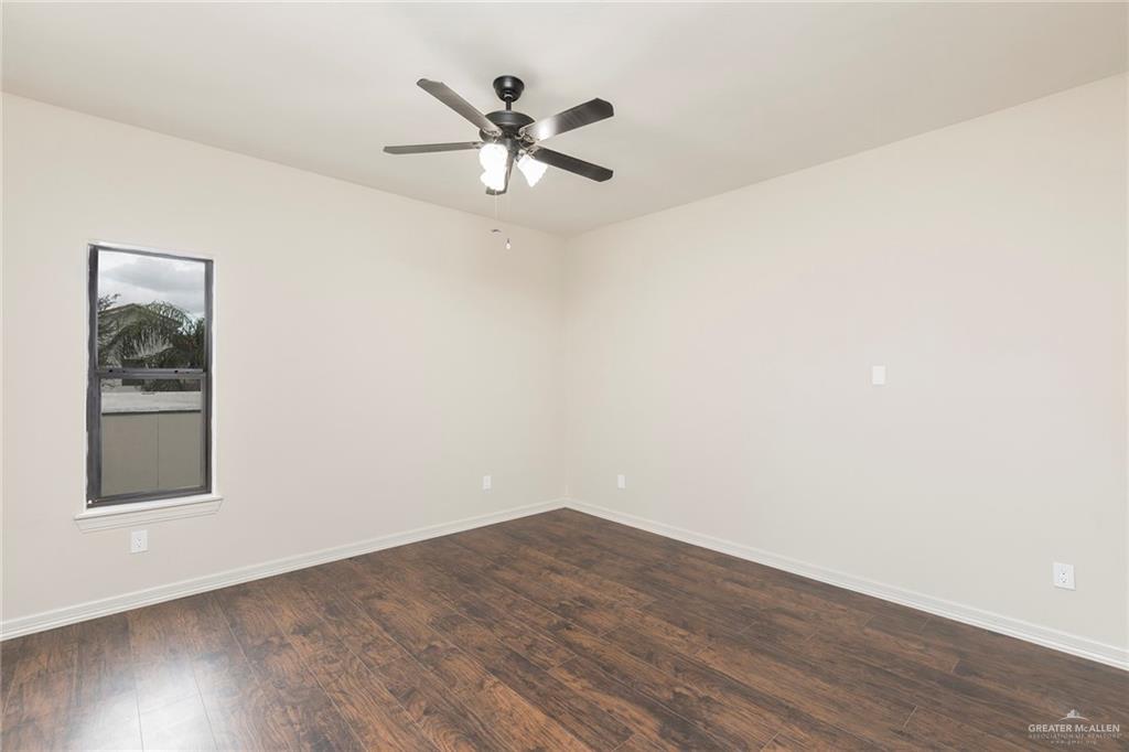 2216 South 45th Street McAllen, TX 78503 - Photo 27 of 40 an empty room with wooden floor closet and windows