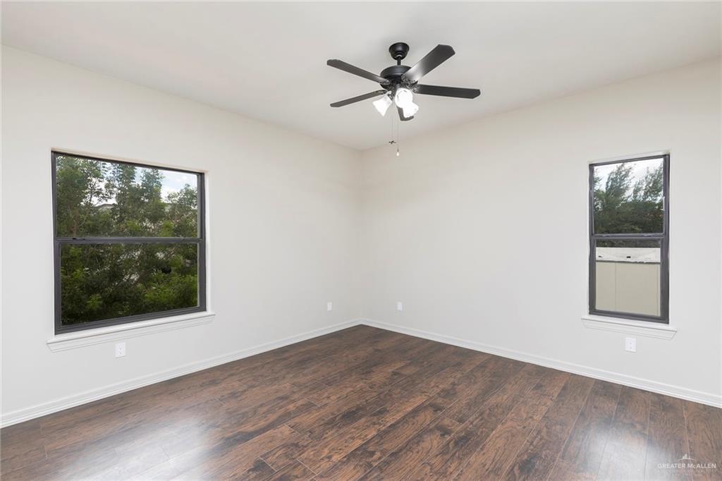 2216 South 45th Street McAllen, TX 78503 - Photo 28 of 40 a view of a big room with wooden floor and windows