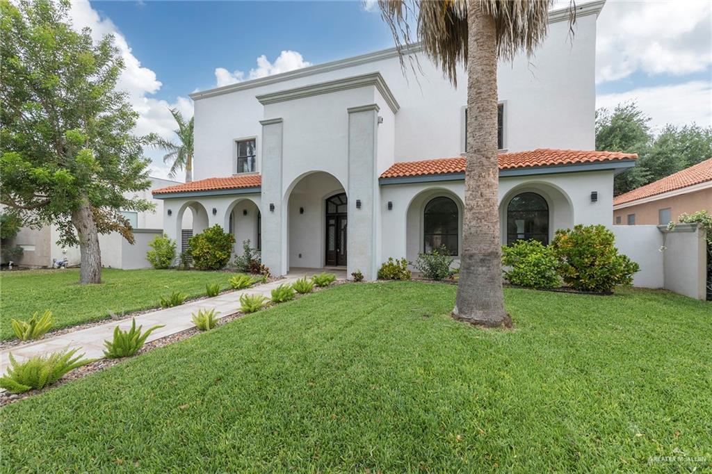 2216 South 45th Street McAllen, TX 78503 - Photo 3 of 40 a front view of a house with yard and porch