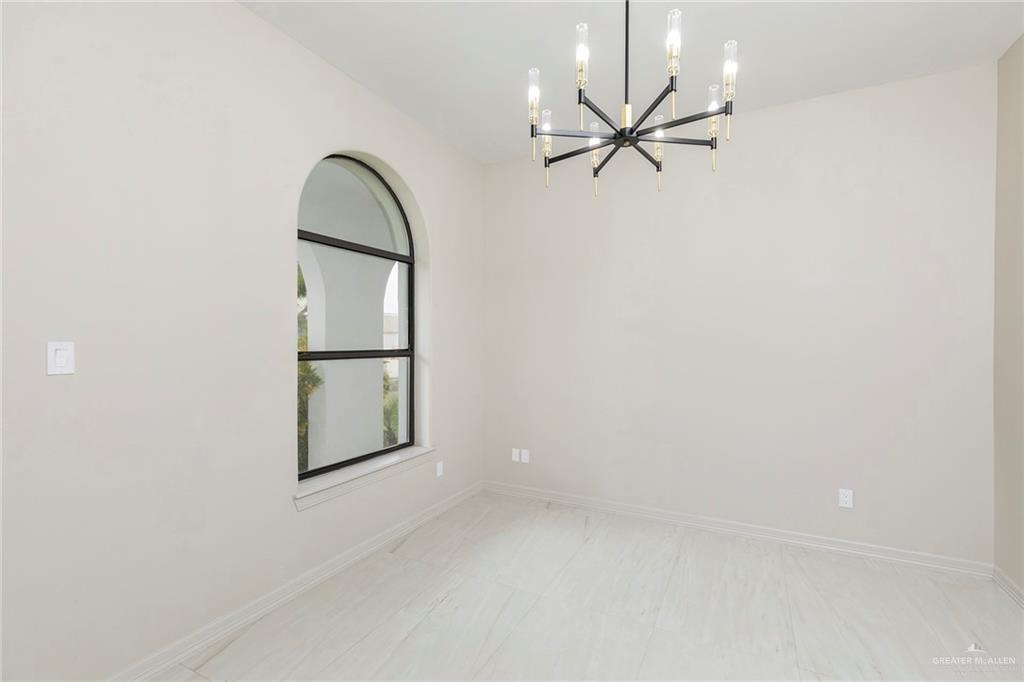 2216 South 45th Street McAllen, TX 78503 - Photo 5 of 40 an empty room with fan and windows