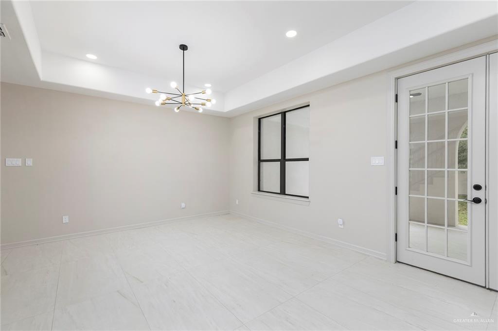 2216 South 45th Street McAllen, TX 78503 - Photo 10 of 40 an empty room with windows and entrance