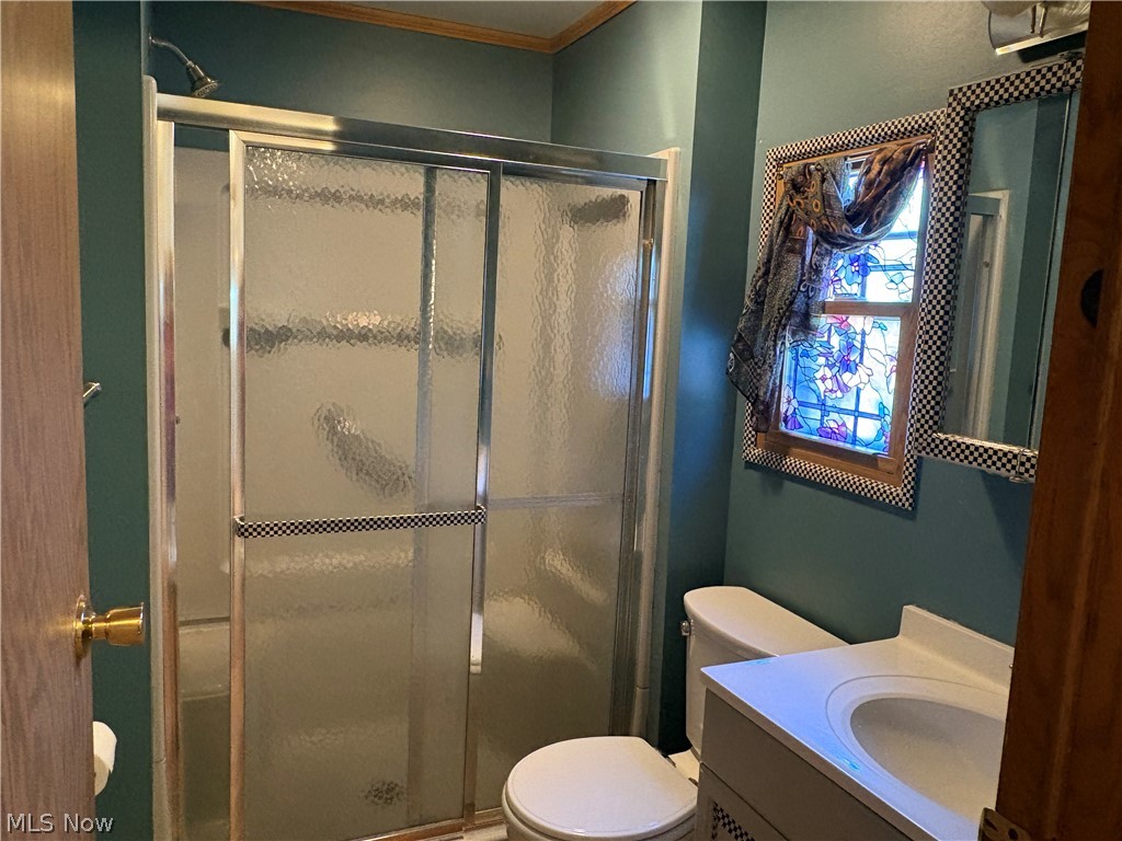 8701 Mayfield Road, Unit 148 Chesterland, OH 44026 - Photo 15 of 22 Bathroom 2 featuring a glass-enclosed shower, single vanity, and toilet