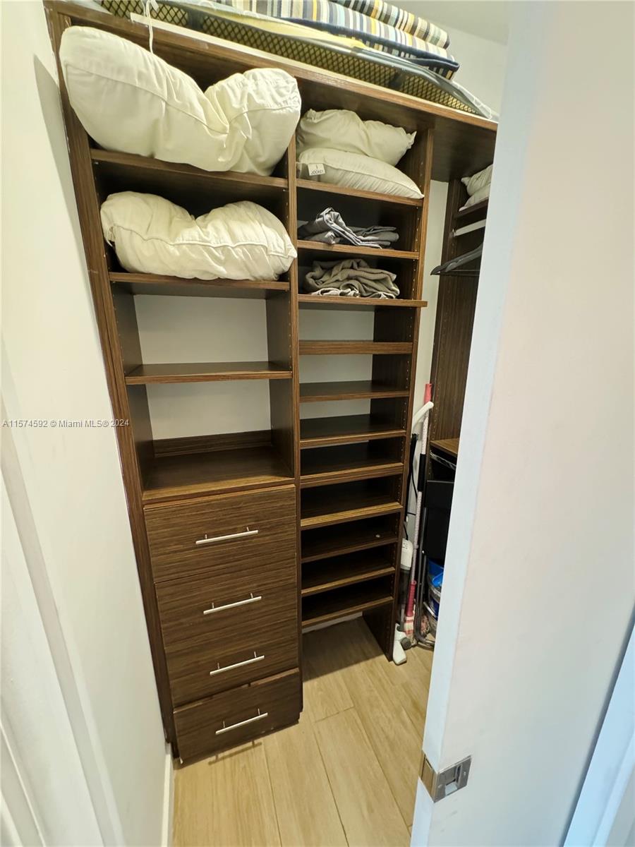 700 16th Street, Unit 108 Miami Beach, FL 33139 - Photo 8 of 10 a view of walk in closet with clothes and shoes