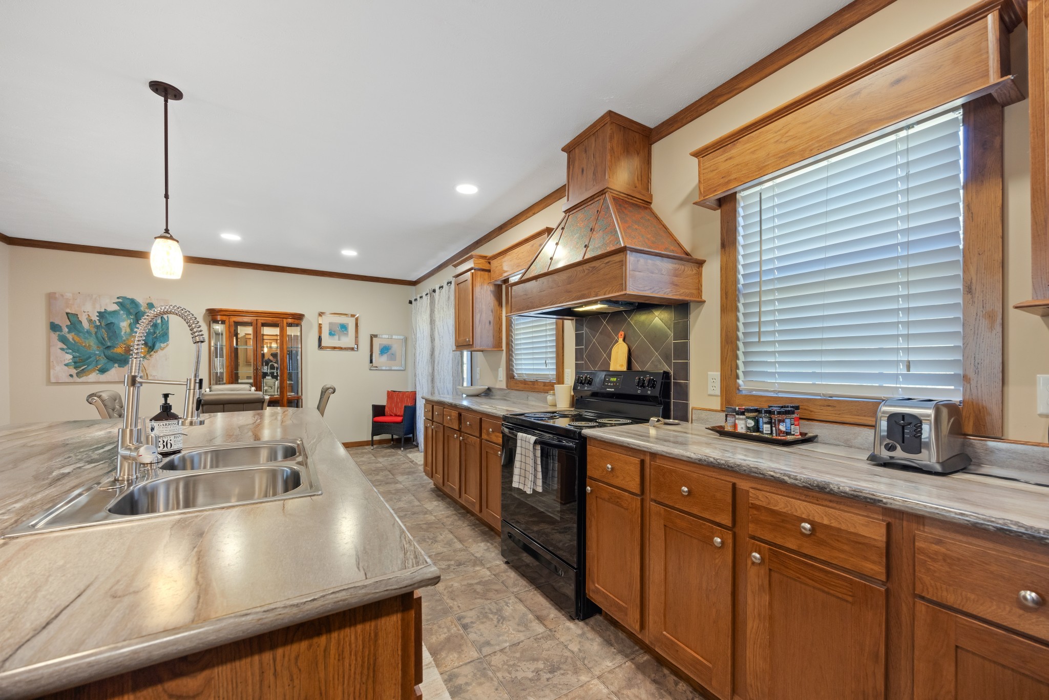 978 Bancroft Road McDonald, TN 37353 - Photo 10 of 29 a kitchen with stainless steel appliances granite countertop sink stove and cabinets