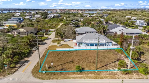 an aerial view of residential building with parking space