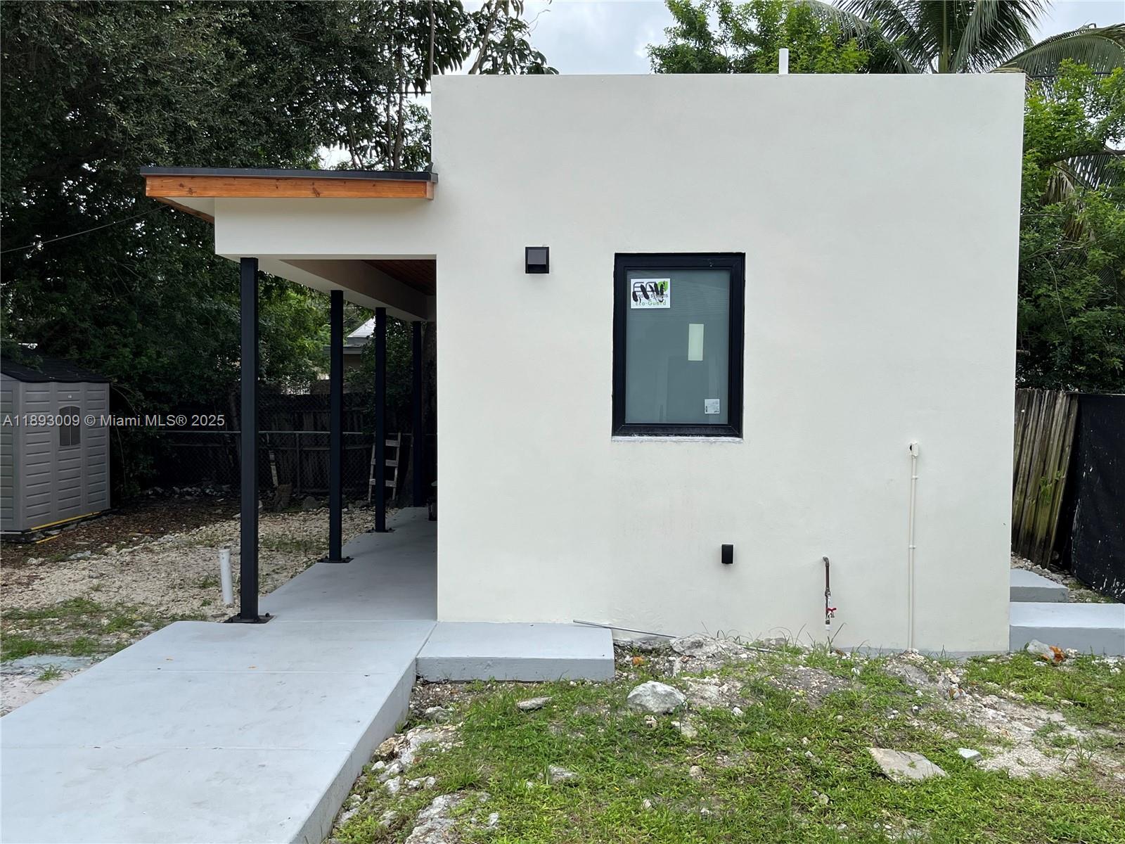 150 Northwest 44th Street Miami, FL 33127 - Photo 11 of 16 a front view of a house with garden