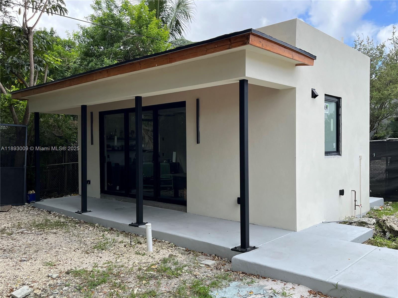 150 Northwest 44th Street Miami, FL 33127 - Photo 12 of 16 a backyard of a house