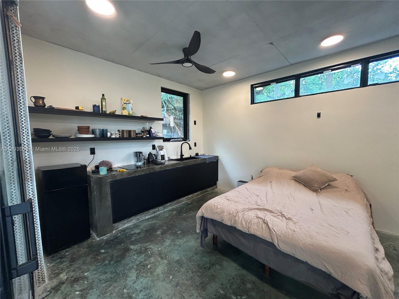 150 Northwest 44th Street Miami, FL 33127 - Photo 13 of 16 a kitchen with a sink and cabinets