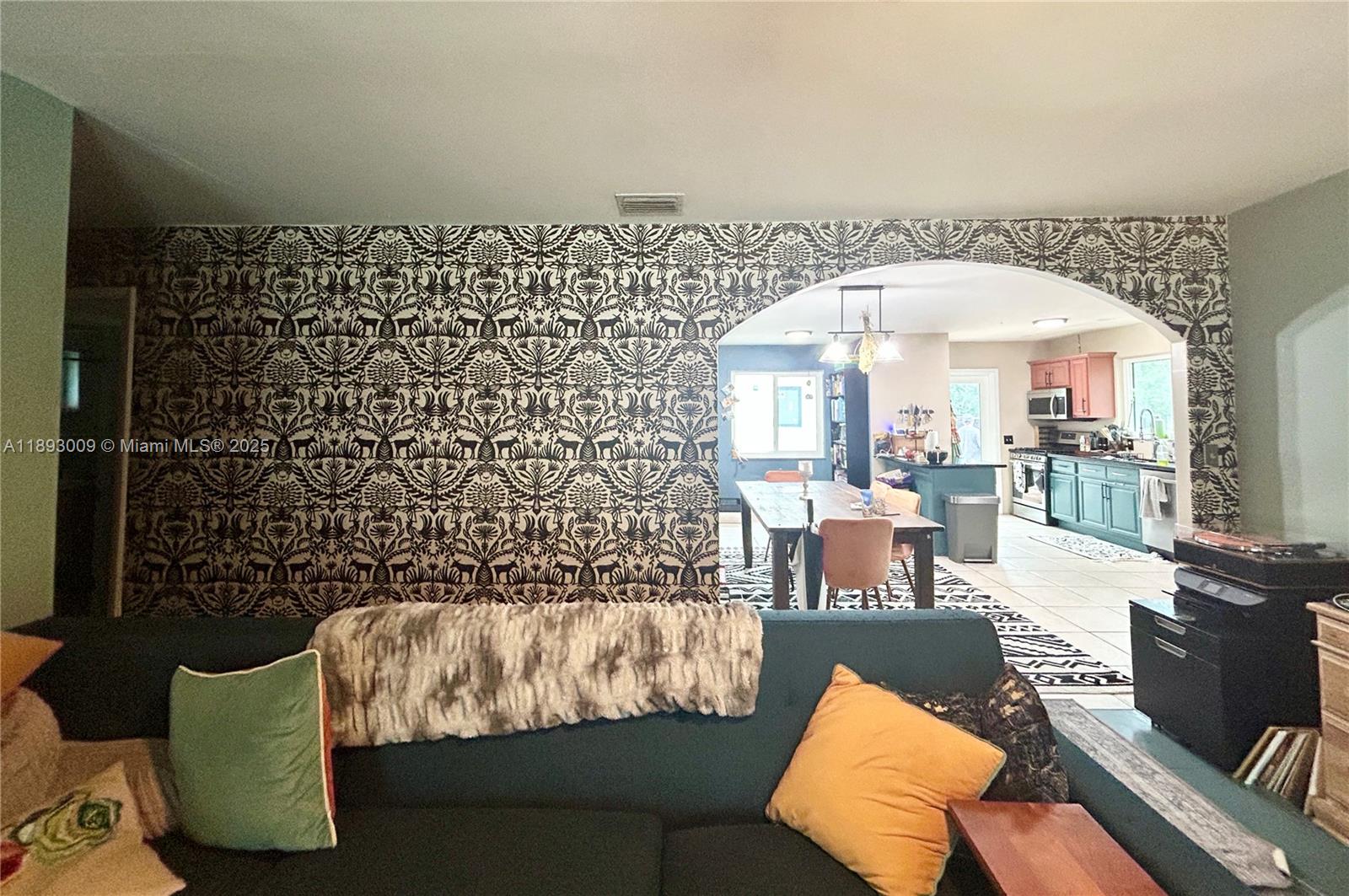 150 Northwest 44th Street Miami, FL 33127 - Photo 6 of 16 a living room with furniture and a large window